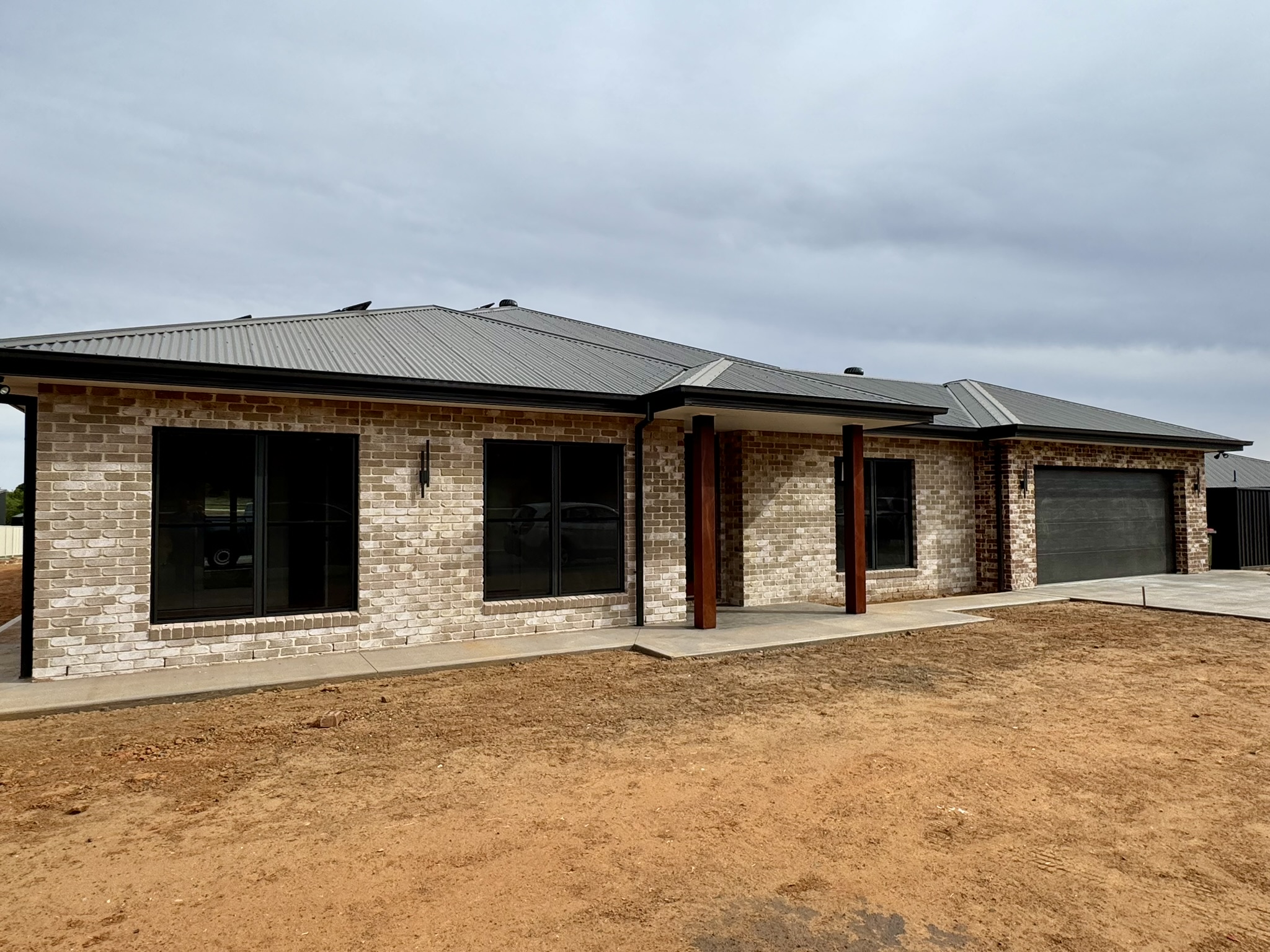 Newly finished brick home in Dubbo built by Robinson & Fuller Homes, before landscaping